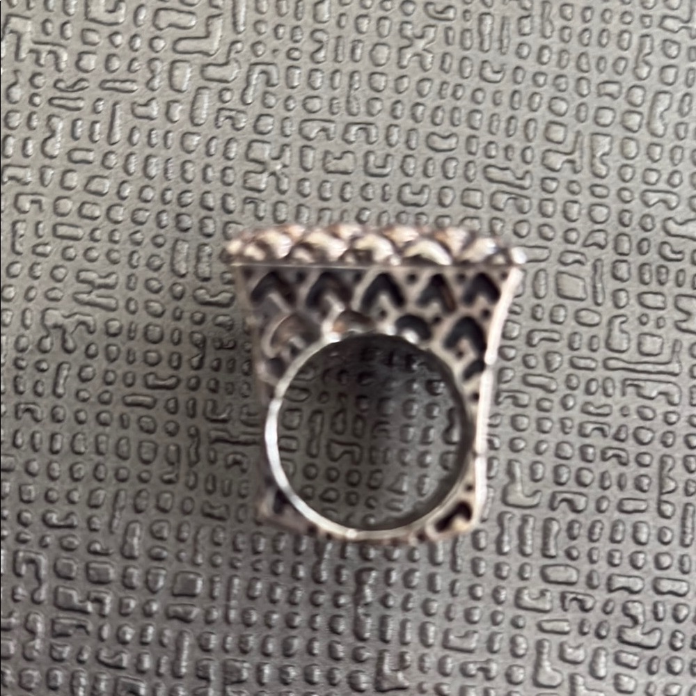 Silver Ring Top length is 1" Wifth is 1/2 inch. Makes a dramatic statement